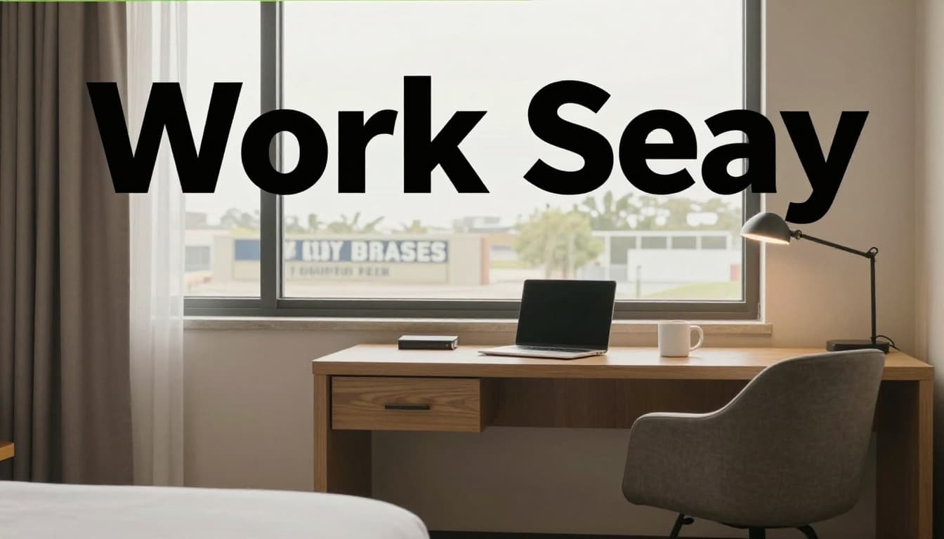 Cozy hotel room designed for business travelers, featuring a work desk with laptop and coffee mug under warm lighting and neutral tones. A large window reveals a distant military base sign, with a prominent 'Work Stay' headline in bold green band at the top.