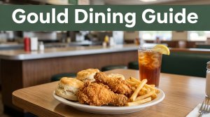 Fried chicken, biscuits, fries, and iced tea on a diner table.