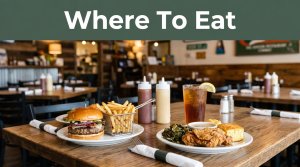 Southern dinner, burger, fries, and iced tea on a restaurant table with a green banner above.