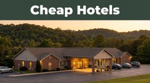 A modest roadside hotel glows in the golden light near rural hills.