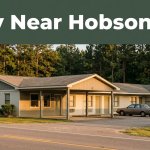 A budget roadside motel in rural Alabama under warm evening light.