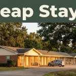A modest motel with one car, oak trees, and a dark-green headline band at sunset.