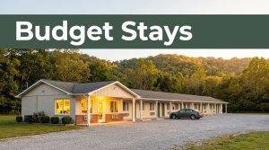 A clean, modest roadside motel with a warm office at golden hour near rolling hills.