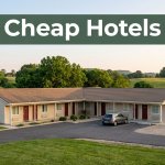 A roadside motel with a parked car, green hills, and a dark-green Cheap Hotels banner.