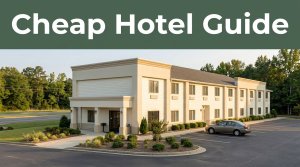 A two-story roadside hotel with a landscaped entrance and warm afternoon light.