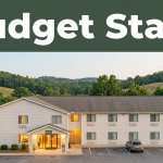 Roadside budget motel near Union Grove with a parked car, trees, hills, and a green banner.