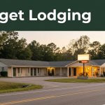A warmly lit rural motel at golden hour with quiet trees and an empty two-lane road.