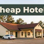 A clean roadside budget motel in rural Alabama during golden hour with parked cars.