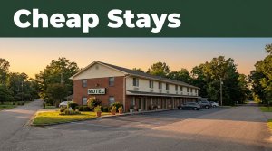 A modest two-story roadside motel in rural Alabama during golden hour.
