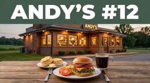 A roadside diner with a burger, biscuits, and coffee on a wooden table.