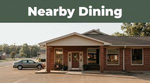 Restaurant entrance in De Queen beneath a Nearby Dining banner, with a parked car outside.