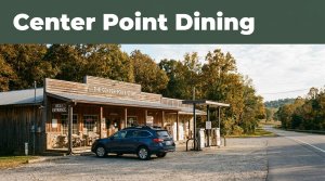 Rural Arkansas store with fuel pumps, a deli entrance, and a parked vehicle.