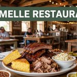 A barbecue platter sits on a table beneath a green Maumelle Restaurants banner.