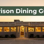 A vintage diner in Harrison, Arkansas, glows at sunset beneath a Harrison Dining Guide banner.