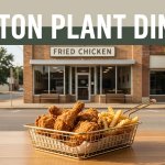 Fried chicken and sides sit on a wooden table outside a small-town Arkansas restaurant.