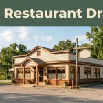A small Arkansas cafe with warm windows beside a sunny roadside.