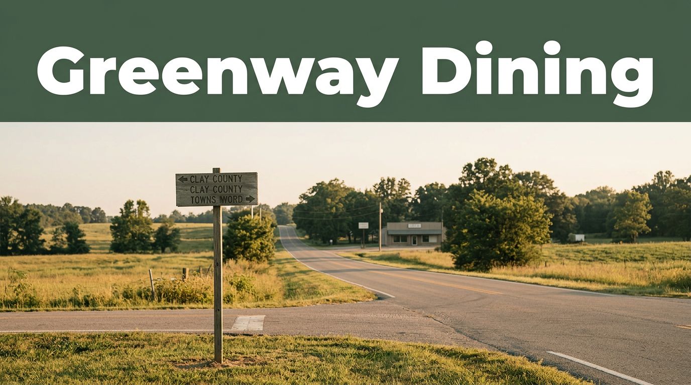 A rural Arkansas crossroads with a directional sign and distant café in morning light.