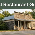 A rural Arkansas general store and lodging building beside a tree-lined road.