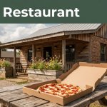 A pepperoni pizza and box sit outside a small Arkansas pizza shack.