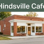 A small roadside café with warm windows and a simple entrance.