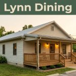 A small country restaurant with porch lights beneath a golden sky.