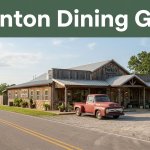 Rustic diner beside a rural highway with a vintage pickup truck outside.