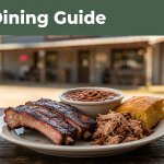 Arkansas barbecue with ribs, pulled pork, beans, and cornbread outside a rural restaurant.