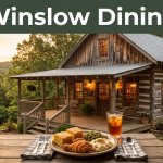 Rustic Arkansas restaurant with warm windows and a plated lunch on the porch at sunset.