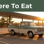 Arkansas drive-in with carhop stalls, a vintage pickup, and pine trees.