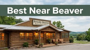 Rustic Rowdy Beaver restaurant with glowing windows and Ozark scenery behind it.