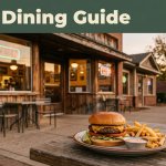 A glowing diner with a burger and fries on an outdoor table.