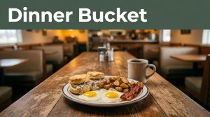 Eggs, biscuits, and coffee sit on a wooden table inside a rural diner.