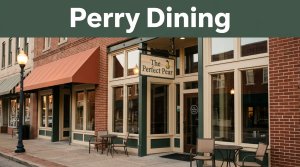 Historic brick restaurant entrance with The Perfect Pear sign in warm evening light.