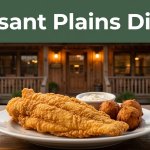 A rustic catfish restaurant with fried catfish and hushpuppies in front.