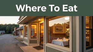 A country diner glows at sunset with a set table visible through the window.