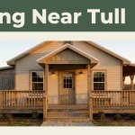 Warmly lit Arkansas restaurant with a porch beneath a green Dining Near Tull header.