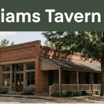 Historic Williams Tavern in Washington, Arkansas, with a brick facade and shaded porch.