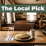 Comfort food and coffee on a wooden table in a warmly lit Arkansas diner.