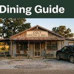 A rural Arkansas grill with a picnic table and parked vehicle at sunset.