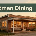 A glowing small-town diner at golden hour with an Arkansas countryside backdrop.