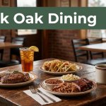 A rustic table holds steak, barbecue, tacos, iced tea, and coffee in a warm diner.