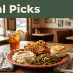 A Southern meal on a rustic table inside a softly lit café.