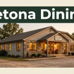 A cozy Arkansas roadside restaurant glows at sunset beneath a Letona Dining banner.