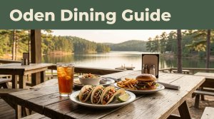 A meal of tacos, a burger, fries, and iced tea sits before an Arkansas lake.