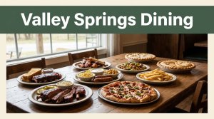 A rustic table holds barbecue, sides, pizza, and pie beside an Arkansas countryside view.