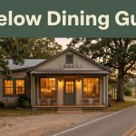 A welcoming roadside restaurant with lit windows, trees, and a quiet country road.