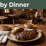 A steak dinner on a wooden table inside a rustic restaurant.
