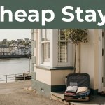 A guesthouse overlooks Bideford waterfront with a packed suitcase by the entrance.