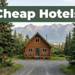 A cozy cabin B&B near Fishhook, Alaska, with spruce trees and mountain views.