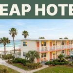 Affordable beachfront motel with palm trees and sandy shoreline in Gulf Shores.